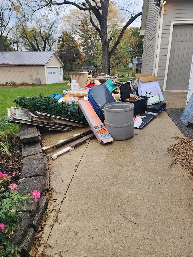 Dumpster being loaded with debris for Residential Dumpster Rental in Westlake
